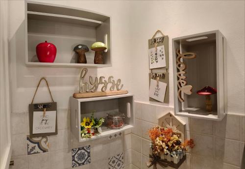 a room with shelves with clocks and other items at Maison du VALe in Sesta Godano