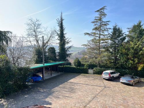 a parking lot with two cars parked in it at Callegherie 21 Boutique B&B in Imola