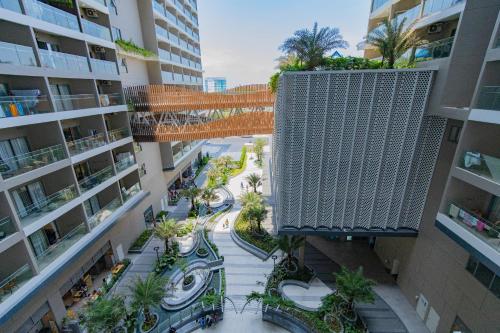 an overhead view of an apartment complex with a walkway between buildings at Cloud Nine The Song Vung Tau Homestay in Vung Tau