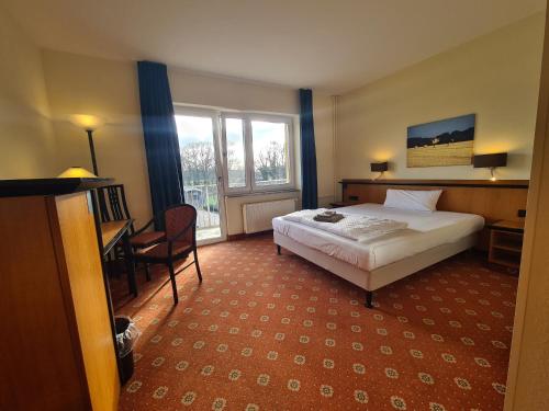 Postel nebo postele na pokoji v ubytování Landhotel Löwenbruch