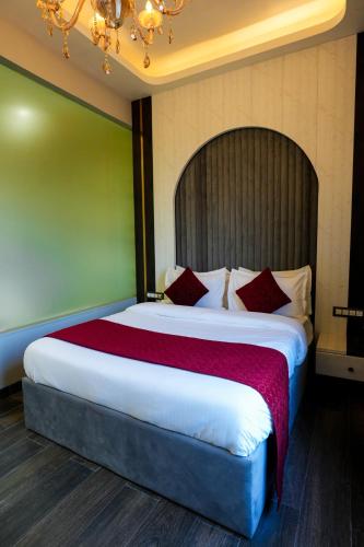 Hotel Adsan Heightsにあるベッド