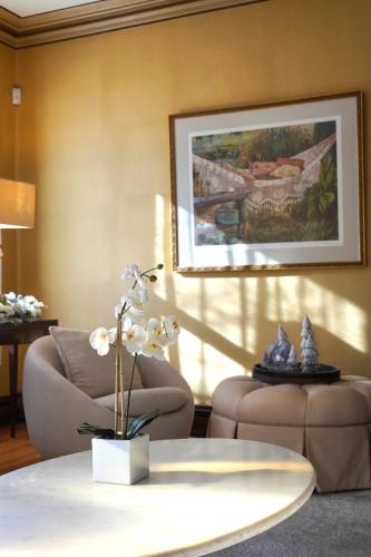 a living room with two chairs and a table at The Underwood-Hale House in Providence