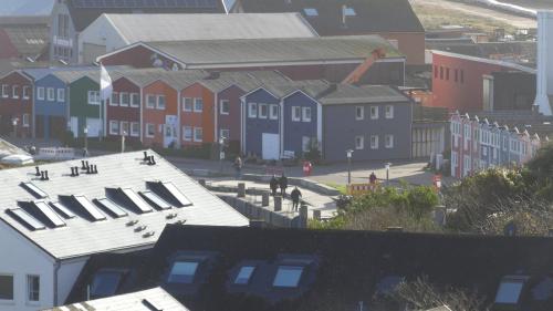 an aerial view of a city with buildings and a street at Am Hingstgars in Helgoland