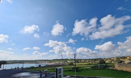 a view of a body of water with clouds in the sky at Sensi Hotel in Marsaskala