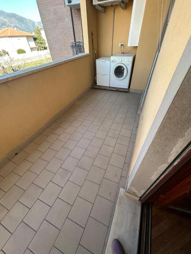 a washing machine on a balcony with a window at A&F House in Terni