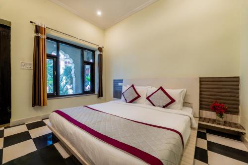 a bedroom with a large bed in a room at The Countryside Resorts - Refined by Nature in Pushkar