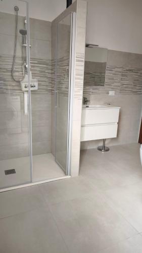 a bathroom with a shower and a sink at Vitachiara Apartment - West Sicily Experience in Santa Ninfa