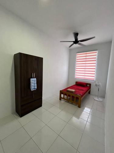 Postel nebo postele na pokoji v ubytování Arizah HOMESTAY