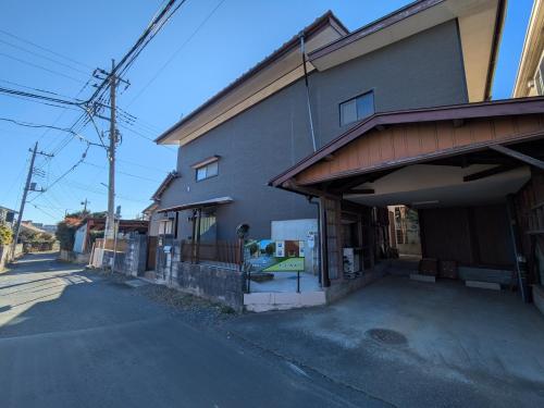 an empty street in front of a building at お宿みとしる in Mito
