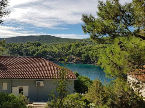 a house with a view of a river at Holiday House Jagoda -First Row to the Sea Brbinj in Brbinj