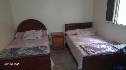 Postel nebo postele na pokoji v ubytování دار الكرم للمبيت والافطار