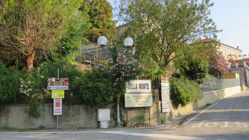 a street corner with signs on the side of a road at Corte Arancio your home in the heart of Monferrato in Cella Monte