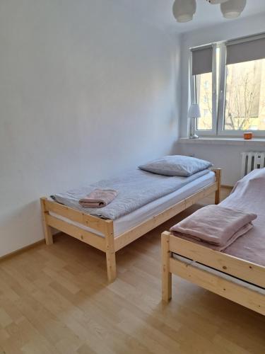 Ένα ή περισσότερα κρεβάτια σε δωμάτιο στο Apartament Żółkiewski