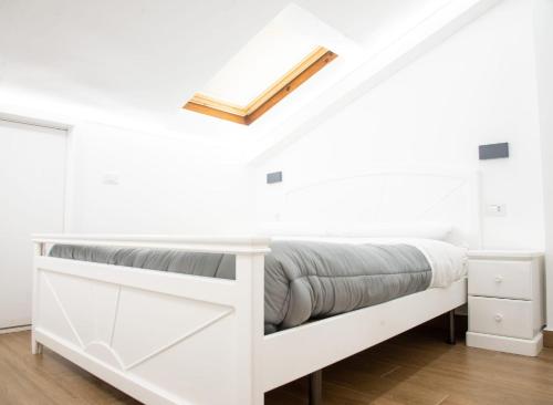 Ένα ή περισσότερα κρεβάτια σε δωμάτιο στο La casa tra i laghi