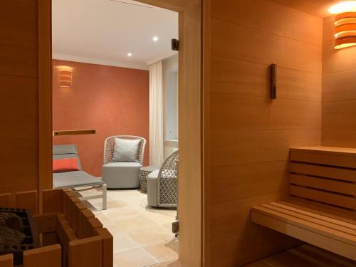 a door leading into a waiting room with chairs at ApartHotel Seepferdchen in Hörnum