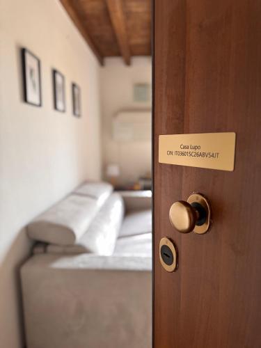 a room with a door with a bed in it at Casa Lupo - Appartamento completo in Formigine