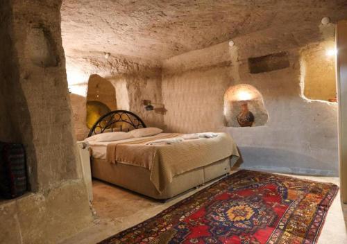 Postel nebo postele na pokoji v ubytování Peri Cave Hotel