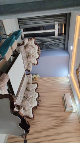 an overhead view of a living room with a wooden floor at Aerial Abode Penthouse in Dehradun