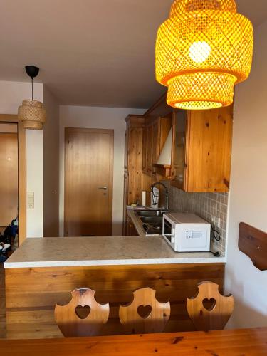 a kitchen with a counter top with a light at Sonnenalpe Nassfeld in 1500 m Höhe an der Skipiste in Sonnenalpe Nassfeld