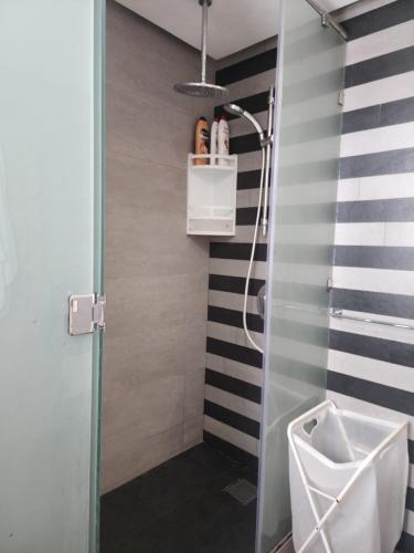 a bathroom with a shower with a sink and a toilet at Casablanca Marina by Saloua in Casablanca