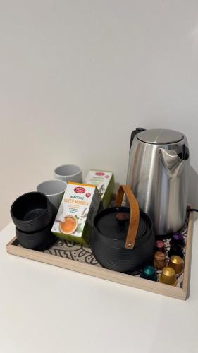 a wooden shelf with a coffee pot and other items on it at Casa Volpe in Salzburg