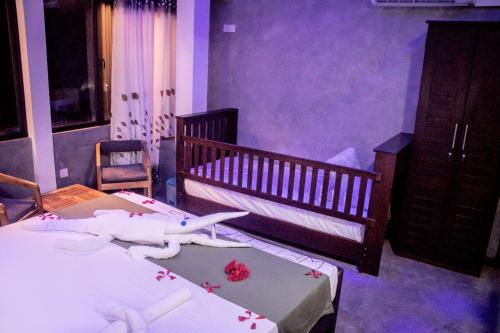 a bedroom with a bed with a shark on it at A2 HavenX in Hikkaduwa