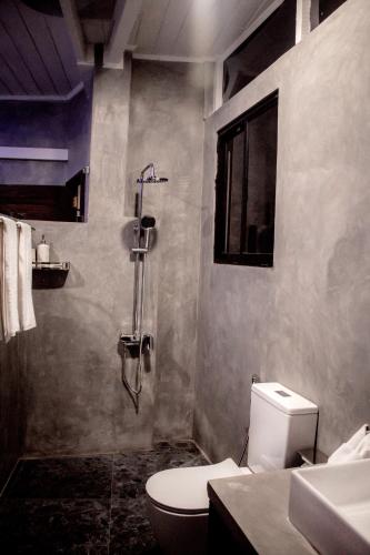 a bathroom with a toilet and a shower at A2 HavenX in Hikkaduwa