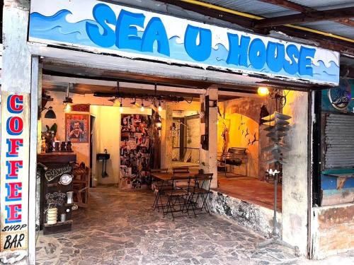 a store with a sign that reads sea owl house at Sea U House in Haad Rin