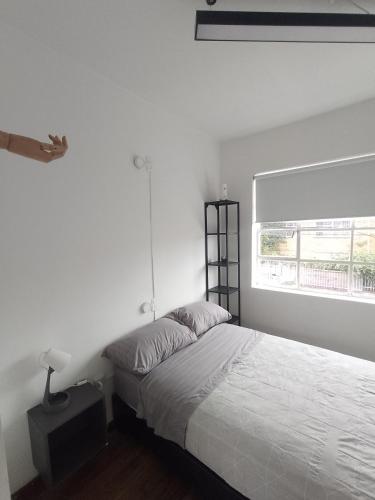 Postel nebo postele na pokoji v ubytování Casa Yolo Bogotá