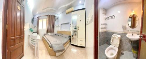 胡志明市Kim's studio的一间带床、水槽和卫生间的浴室