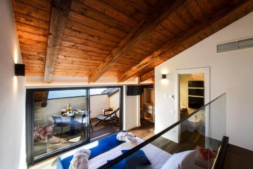 a view of the living room and dining room of a house at Kemì Luxury Suites in Vietri sul Mare