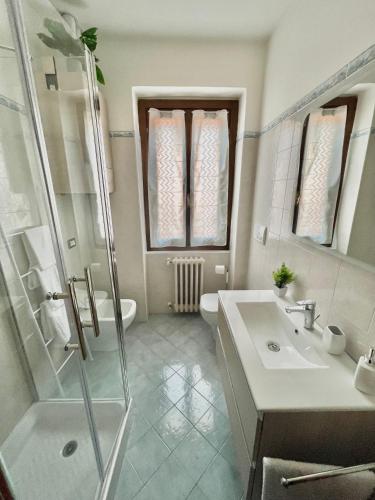 a bathroom with a shower and a sink and a toilet at La Casa di Agnese in San Benedetto Val di Sambro