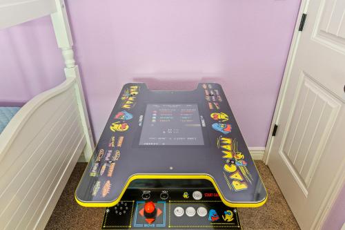 a game console in a corner of a room at Sconset South 4BR Beach Escape! Deck, Bar, Games & Gulf Views in Port Bolivar