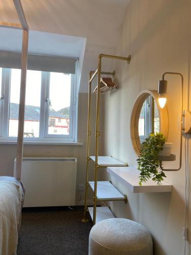 a bathroom with a sink and a mirror at Bowness Bay View in Windermere