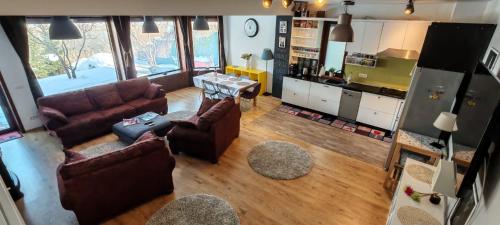 an overhead view of a living room with couches at Family Villa Lake View in Moara Vlăsiei