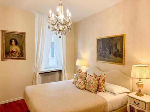 En eller flere senge i et værelse på Palazzo Tiolo