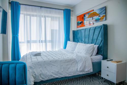 Postel nebo postele na pokoji v ubytování Nyayo View Studio with Amazing Views