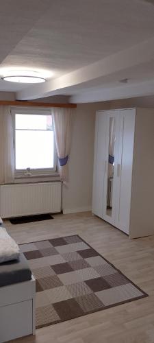 Кровать или кровати в номере Ferienwohnung Käthchen