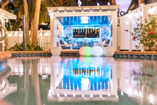 a pool at a resort with a poolside bar at Private Heated Pool - 100 Steps to Beach Access - 5-min walk to Siesta Key Village in Siesta Key