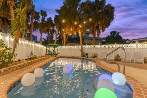 a swimming pool with a spa in a backyard at Private Heated Pool - 100 Steps to Beach Access - 5-min walk to Siesta Key Village in Siesta Key