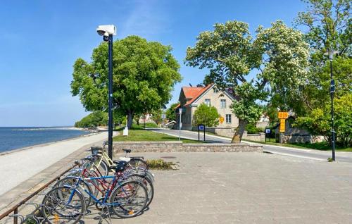 a group of bikes parked next to a light pole at Awesome Apartment In Visby With Wifi in Visby
