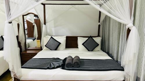 Postel nebo postele na pokoji v ubytování O2 Villas-Weligama