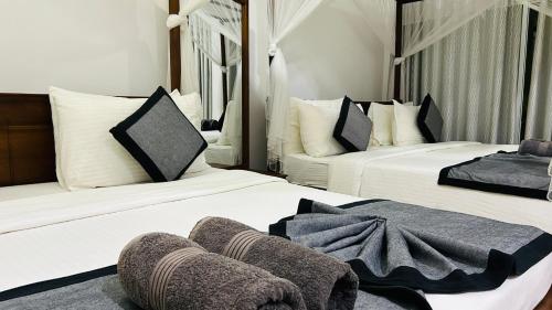 Postel nebo postele na pokoji v ubytování O2 Villas-Weligama
