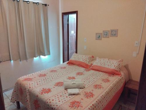 Una cama o camas en una habitación de Aconchego Canastra Hotel