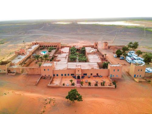 an aerial view of a building in the desert at Kasbah Erg Chebbi in Merzouga