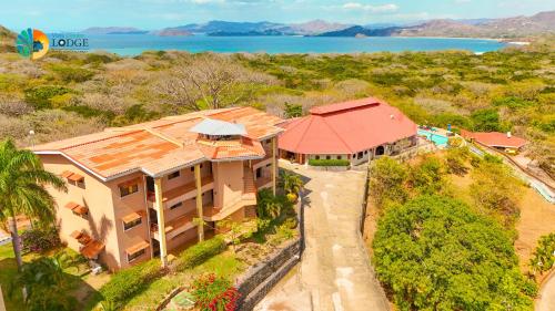 an overhead view of a house with a red roof at Vista Condor Lodge in Puerto Viejo