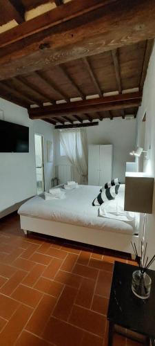 Postel nebo postele na pokoji v ubytování suite tuscany home