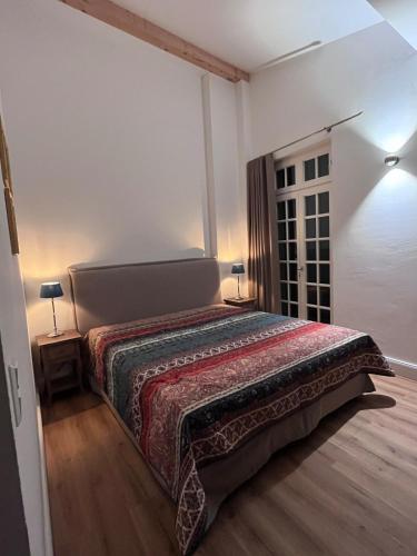 a bedroom with a large bed in a room at Kleiner Marstall in Xanten
