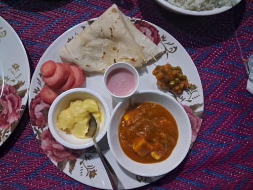 a plate of food with different types of food on it at Sea View Villa in Kondivli