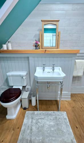 a bathroom with a sink and a toilet at The Old Stables in Fort Augustus